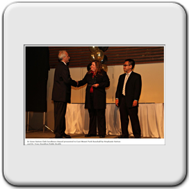 Mike Trafford Accpeting The Award from Stephanie Sutton ( daughter of Dr. Gene Sutton ), and Dr. Tran, from Hamilton Public Health